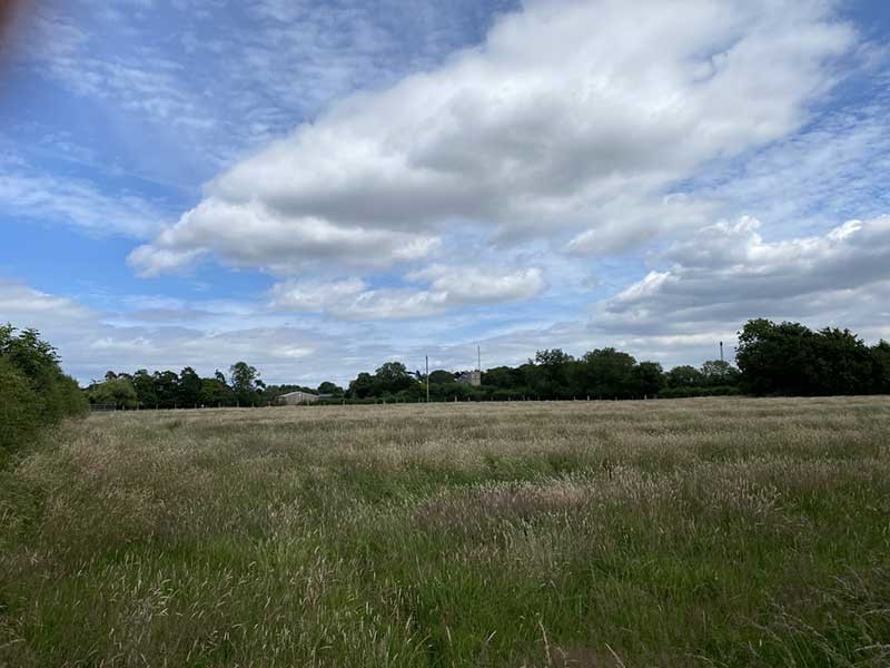 countrysideeasthalton An old fire station door with a bell mounted in a brick arch above it